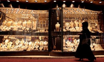 A customer can be seen outside a gold shop